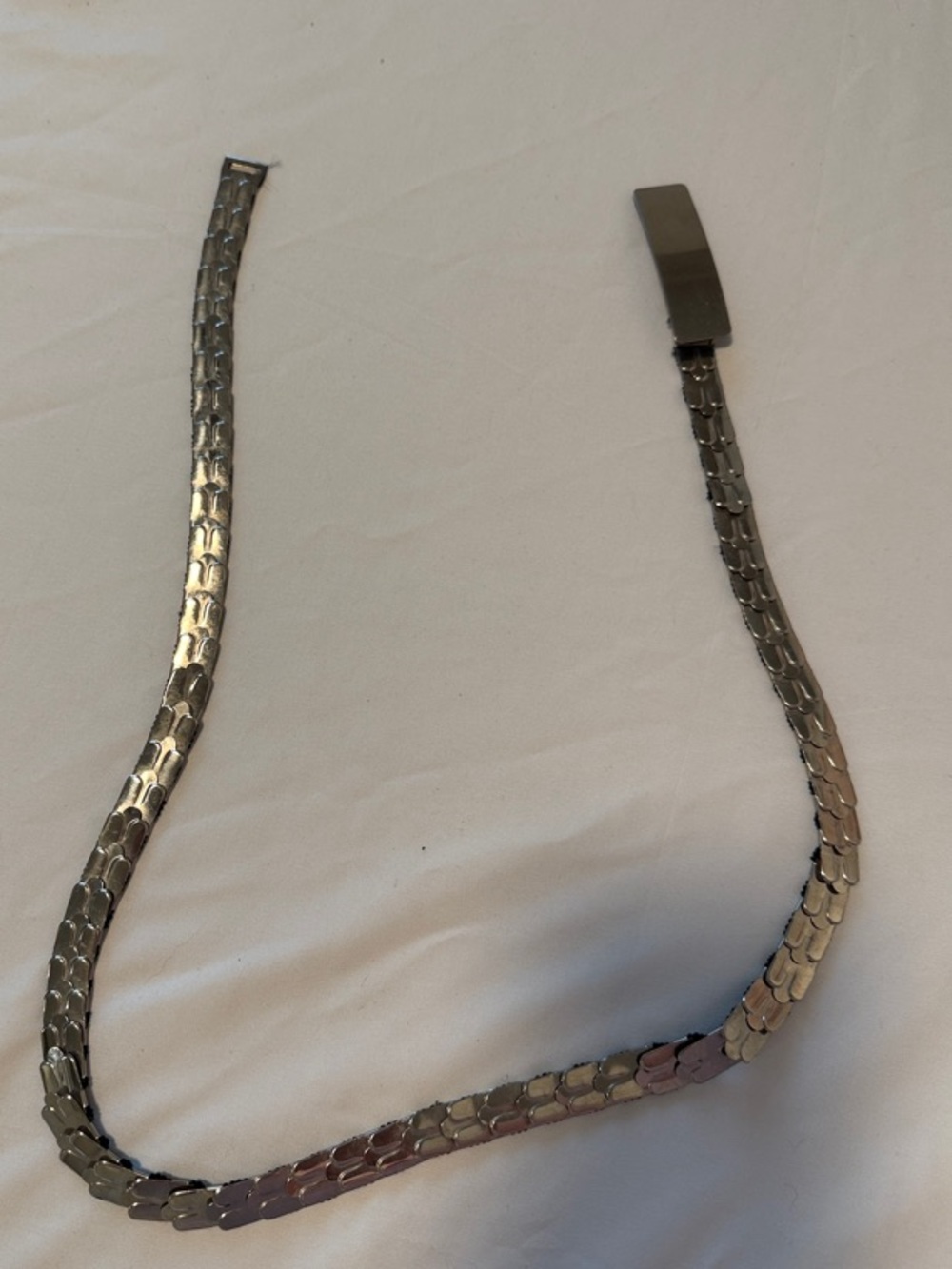 Belt - Silver tone with elastic backing.
